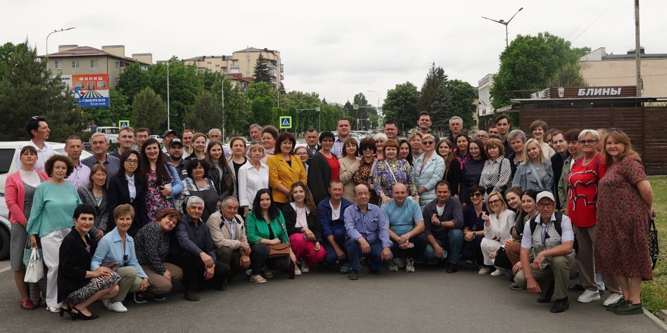 Kirill and Svetlana Gushchin surrounded by friends. May 2024